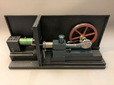 A two-part live steam engine mounted on plinth, height 31cm.