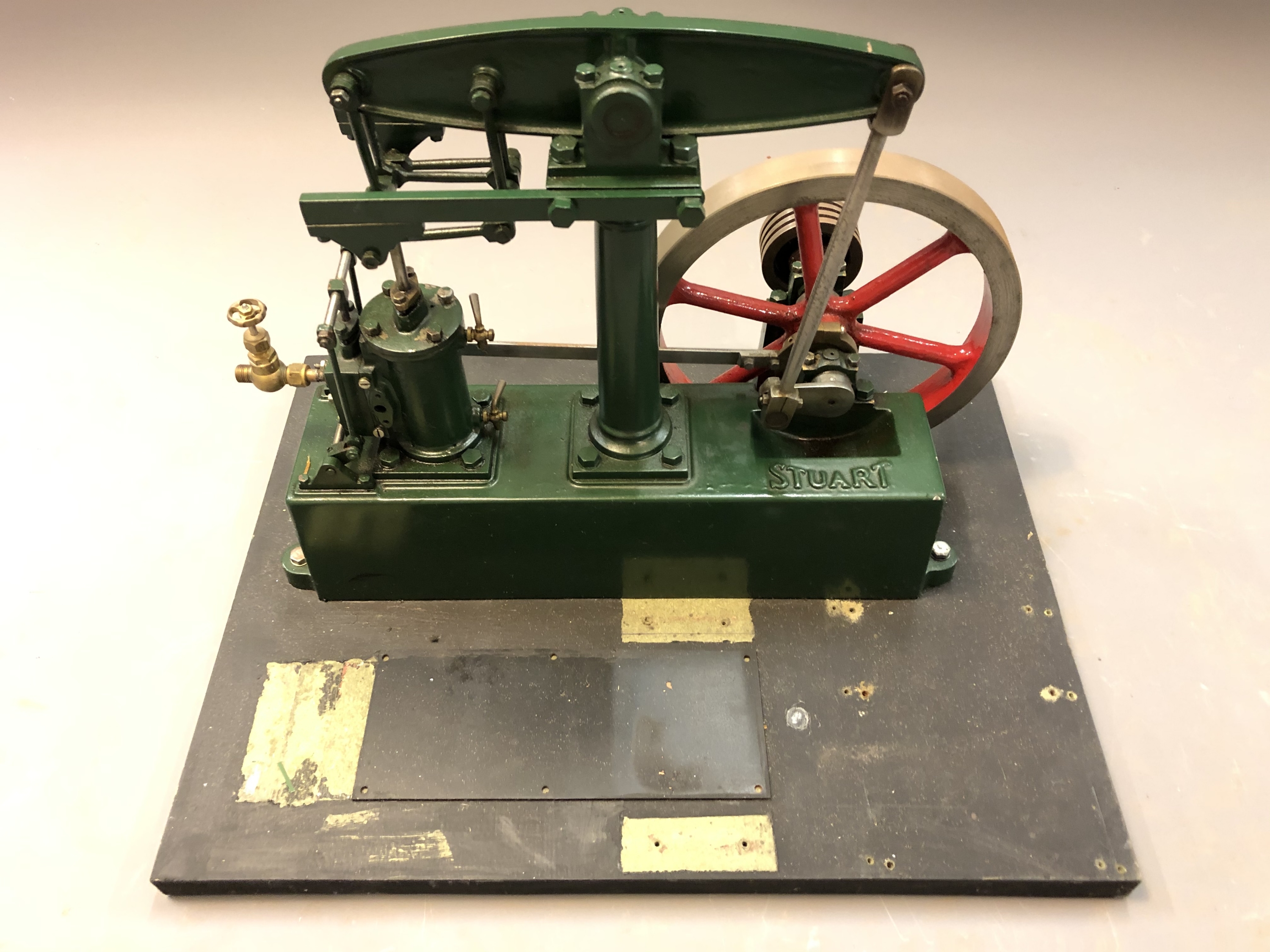 A live steam Stuart beam engine on plinth, height 29cm.