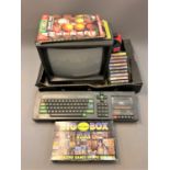 An Amstrad 64K Colour Personal Computer keyboard and monitor, Amstrad magazines,