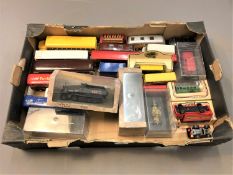 A collection of boxed and unboxed die cast vehicles including buses,