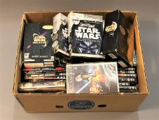 A large quantity of Star Wars DVDs and VHS video tapes.