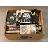 A large quantity of Star Wars DVDs and VHS video tapes.