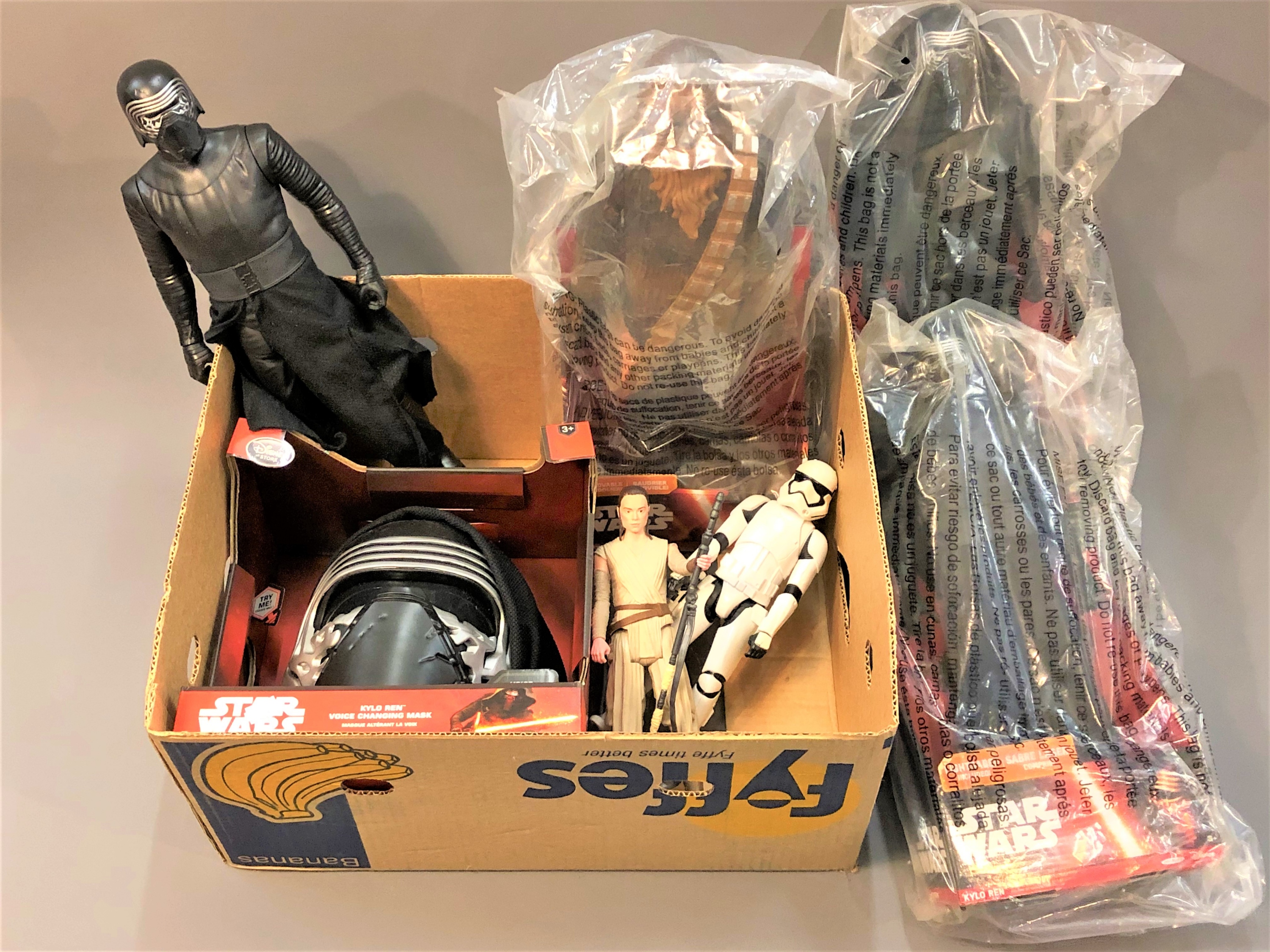 A collection of Disney Star Wars figures including three Kylo Wren, two in original packaging,