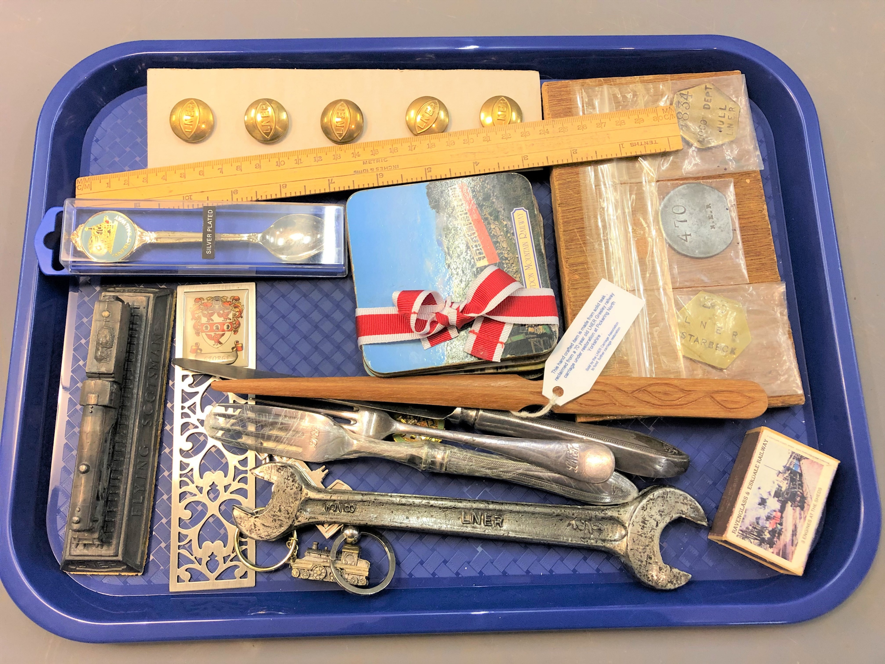 A quantity of collectable relating to trains; LNER spanner and brass buttons, railway tokens,