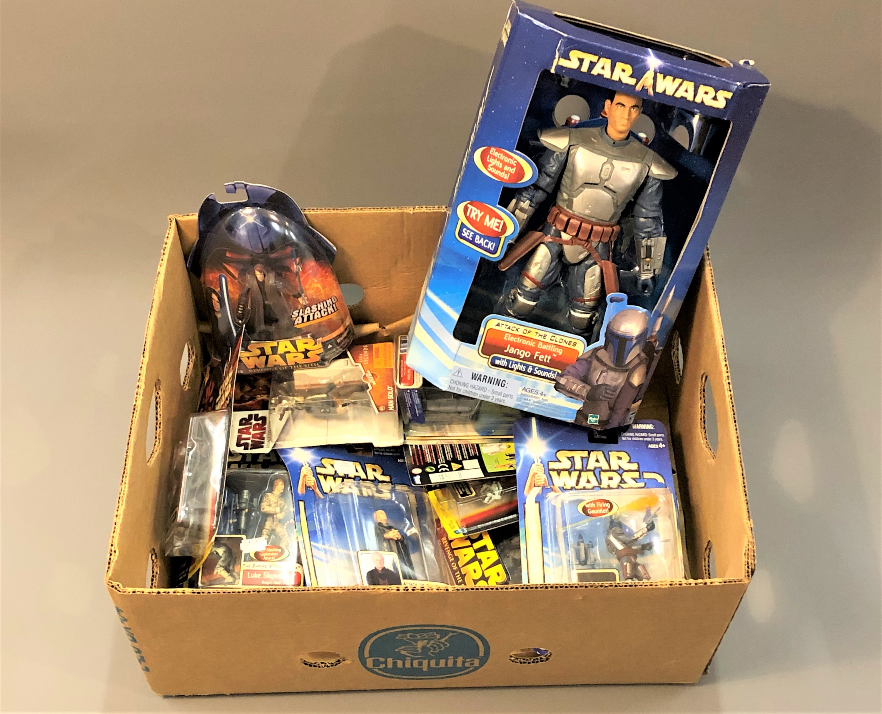 A collection of boxed Star Wars Hasbro figures : Jango Fett, etc, all in original packaging.