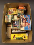 A box of approximately 17 boxed tin plate toys.