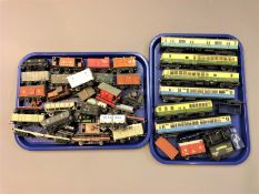 A collection of rolling stock including Tenshodo carriages, unbranded die cast rolling stock etc.