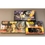 A collection of Star Wars games including Star Wars Saga Edition Monopoly,