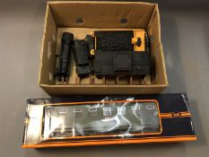 A Lionel Lines die cast locomotive and coal wagon, two Bachmann wagons,