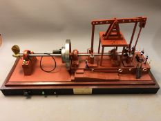 A large model Walking Beam Marine Engine 1904, on plinth under glass cover,