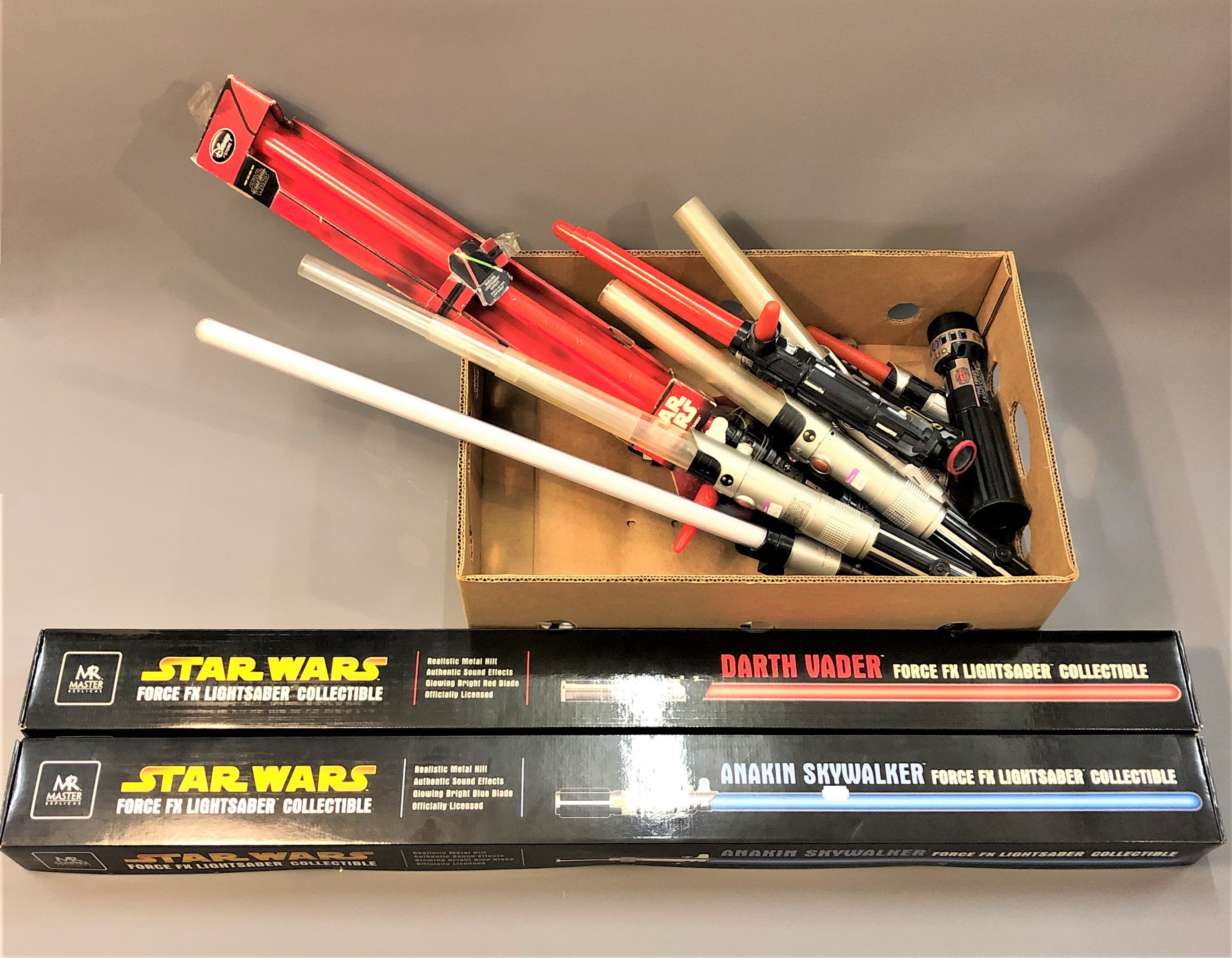 Two Star Wars Force FX Lightsaber collectable's, in original packaging,