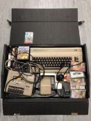 A Commodore 64 together with accessories and games, Data Recorder etc, in travel case.