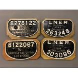 Four cast iron railway wagon plates;