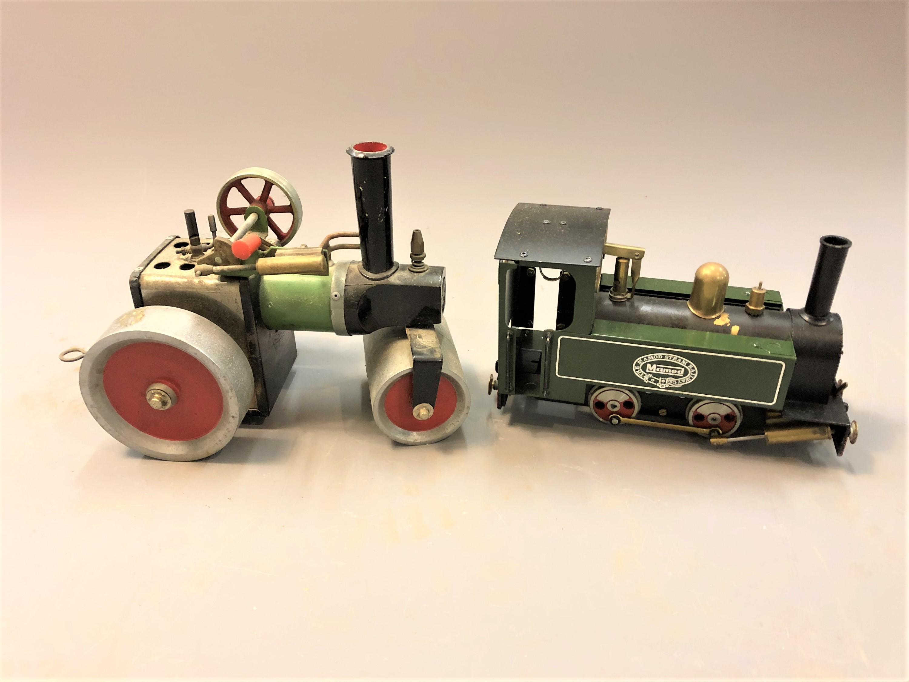 A Mamod steam roller and a locomotive.