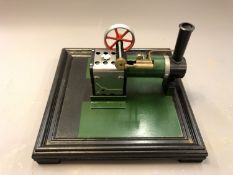 A live steam piston engine on plinth, length 31cm.