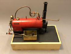 An Invicta live steam boiler on plinth, length 38cm.