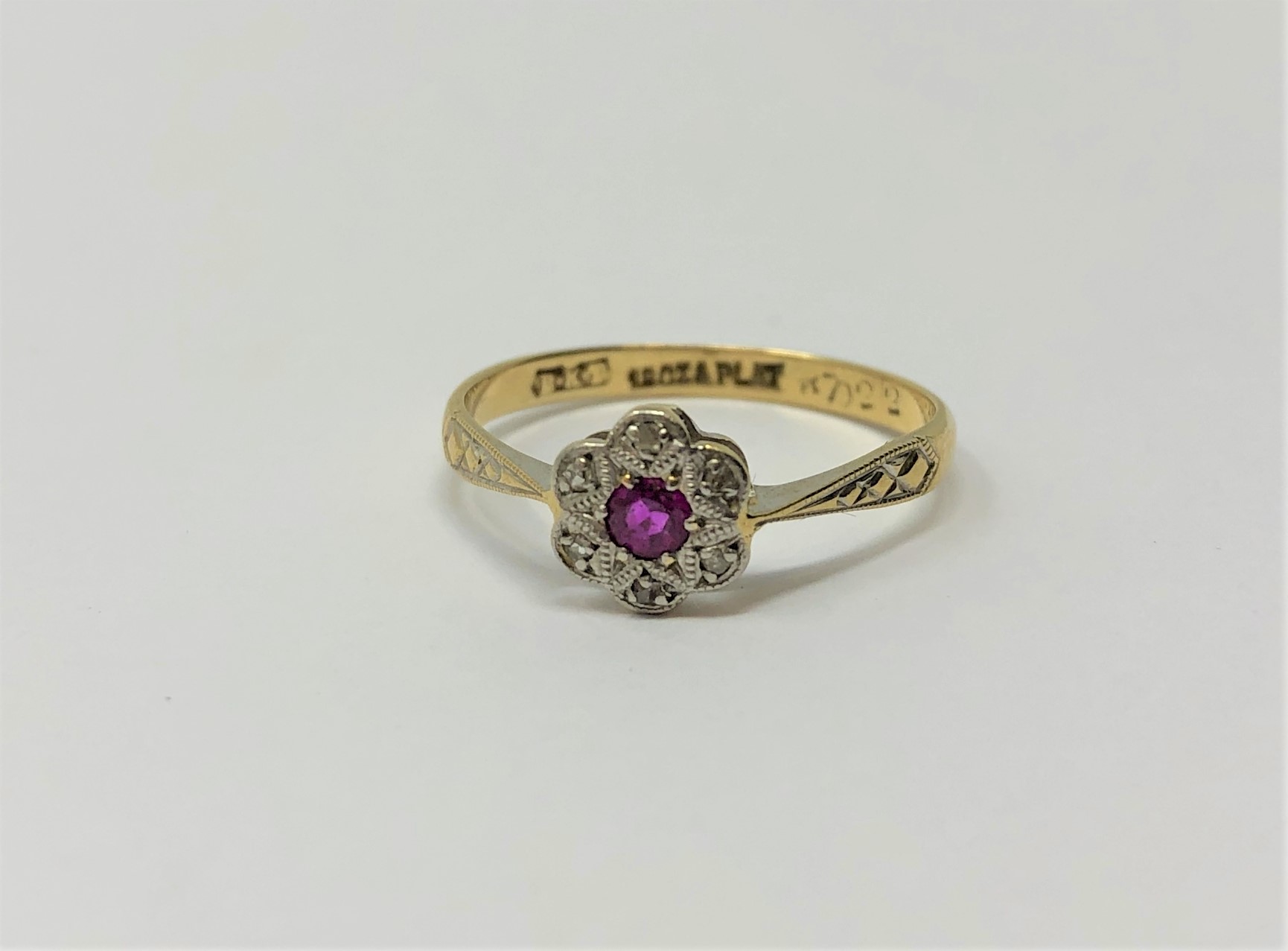 An antique 18ct gold ruby and diamond ring CONDITION REPORT: Ring size N.