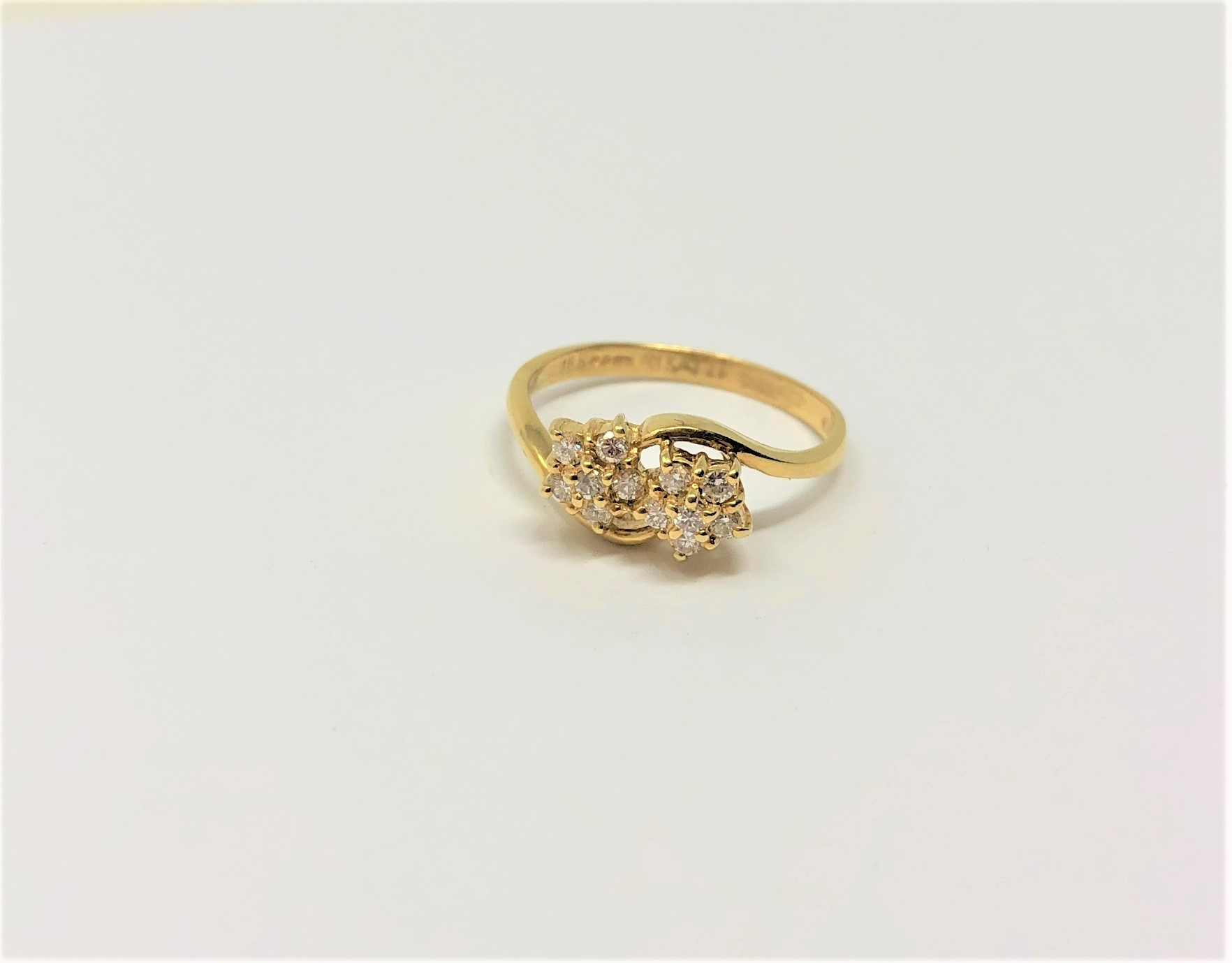 An 18ct gold double diamond cluster ring, 2.77g.