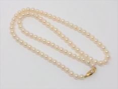 A 20 inch pearl necklace on gold clasp