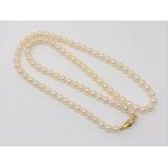 A 20 inch pearl necklace on gold clasp