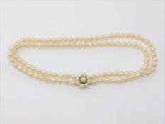 A good double 16 inch strand of pearls with pearl and gold catch CONDITION REPORT: