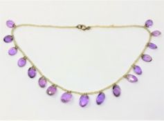 A fine antique amethyst and pearl necklace with gold fittings