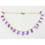 A fine antique amethyst and pearl necklace with gold fittings