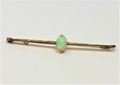 A 15ct gold opal bar brooch