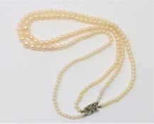 A good double strand of pearls on gold and diamond clasp CONDITION REPORT: Pearls