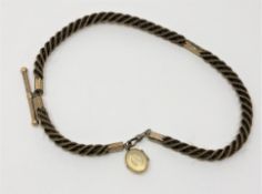 An antique hair Albert chain with gold T-bar, dog-catch and fittings.