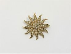 A 15ct gold pearl star brooch, 4.85g.