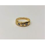 An antique 18ct gold sapphire and diamond ring, 2.85g. CONDITION REPORT: Ring size M.