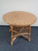 A circular wicker conservatory table