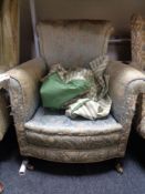A Victorian horse hair filled armchair in floral brocade fabric