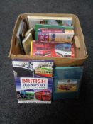 A box of books and DVD box sets relating to transport.