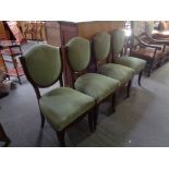 Four 20th century dining chairs in green corded fabric