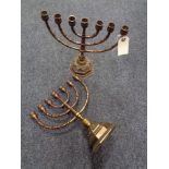 A pair of brass menorah