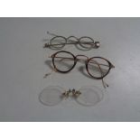 Three pairs of antique spectacles,