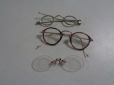 Three pairs of antique spectacles,