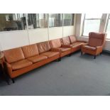 A four piece mid 20th century tan leather lounge suite