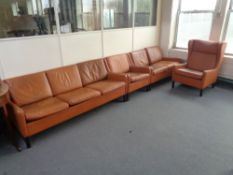 A four piece mid 20th century tan leather lounge suite