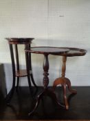 A mahogany two tier plant stand and two wine tables