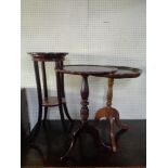 A mahogany two tier plant stand and two wine tables