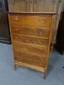 A mid 20th century Danish seven drawer chest in walnut finish