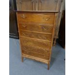 A mid 20th century Danish seven drawer chest in walnut finish