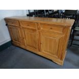 A pine three door three drawer sideboard