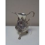 A George III silver cream jug, London marks (rubbed).