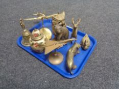 A tray of assorted brass animal figures, hand bell, aircraft on stand,