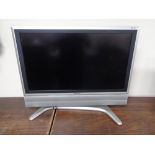 A Sharp Aquos 32 inch LCD TV with remote