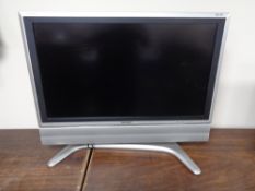 A Sharp Aquos 32 inch LCD TV with remote